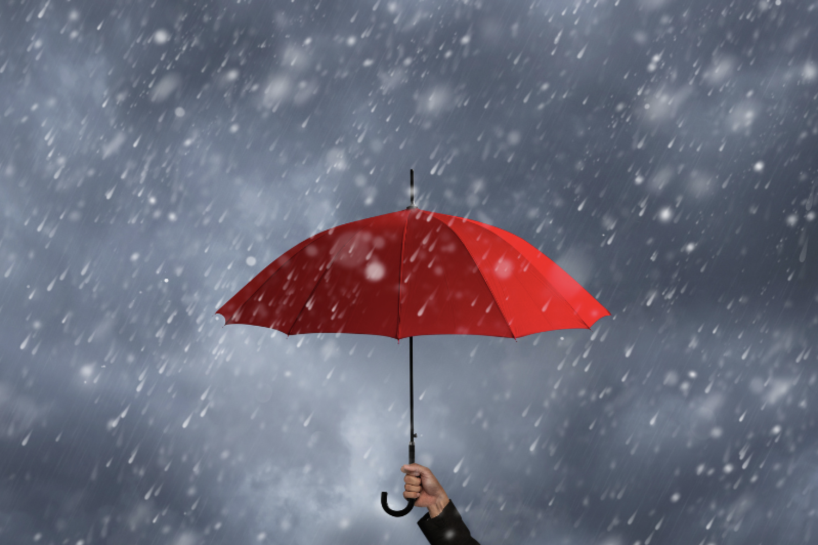 Red umbrella during rainstorm